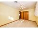 A bedroom features neutral carpet, a ceiling fan, and a closet at 9241 Knox Ct, Westminster, CO 80031