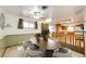 A dining room features a wood table with chairs, a ceiling fan, and access to the kitchen at 9241 Knox Ct, Westminster, CO 80031