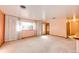 Bright, empty living room with neutral tones and large windows at 9241 Knox Ct, Westminster, CO 80031