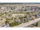 Aerial view of community highlighting neighborhood amenities including a park with sports courts and walking trails at 576 S Tabor St, Elizabeth, CO 80107