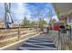 Outdoor deck features a grill, wooded view and lounge area for relaxation and entertaining at 576 S Tabor St, Elizabeth, CO 80107