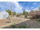 Fenced backyard with shed, offering privacy and storage space at 576 S Tabor St, Elizabeth, CO 80107