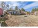 The backyard features a fire pit and a deck, providing ample space for outdoor activities and relaxation at 576 S Tabor St, Elizabeth, CO 80107
