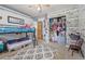 Cozy bedroom with a bunk bed, patterned rug, and a closet with ample storage space at 576 S Tabor St, Elizabeth, CO 80107