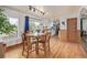 Inviting dining area with hardwood floors, sliding glass doors, and an open layout to the kitchen at 576 S Tabor St, Elizabeth, CO 80107