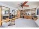 A view of primary bedroom showing natural wood accents and ensuite bathroom entrance at 576 S Tabor St, Elizabeth, CO 80107