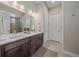 Double vanity bathroom with a walk-in shower at 22537 E Swallow Pl, Aurora, CO 80016