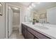 Double vanity bathroom with a tub and shower at 22537 E Swallow Pl, Aurora, CO 80016