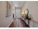 Elegant entryway, hardwood floors, and a modern console table at 22537 E Swallow Pl, Aurora, CO 80016