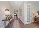 Bright entryway with hardwood floors and stylish console table at 22537 E Swallow Pl, Aurora, CO 80016