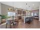 Modern kitchen with dark wood cabinets, white countertops, and stainless steel appliances at 22537 E Swallow Pl, Aurora, CO 80016