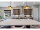 Contemporary kitchen featuring an island and stainless steel appliances at 22537 E Swallow Pl, Aurora, CO 80016