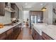 Modern kitchen with farmhouse sink and ample counter space at 22537 E Swallow Pl, Aurora, CO 80016