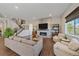 Spacious living room featuring a fireplace and hardwood floors at 22537 E Swallow Pl, Aurora, CO 80016