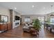 Spacious living room with a stone fireplace and hardwood floors at 22537 E Swallow Pl, Aurora, CO 80016