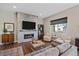 Open living room showcasing a modern fireplace and comfortable seating at 22537 E Swallow Pl, Aurora, CO 80016