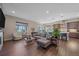 Open and airy living room with kitchen and patio access at 22537 E Swallow Pl, Aurora, CO 80016