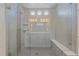 Large walk-in shower with glass enclosure and built-in seat at 22537 E Swallow Pl, Aurora, CO 80016