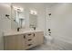 Modern bathroom featuring double sinks, sleek fixtures, and a shower-tub combo at 1372 Lowell Blvd # 4, Denver, CO 80204