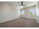 Large bedroom with plush carpet, two windows offering abundant natural light and neutral walls at 1372 Lowell Blvd # 4, Denver, CO 80204
