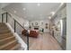 Inviting open-concept living area showcasing hardwood floors, contemporary fireplace, and modern kitchen at 1372 Lowell Blvd # 4, Denver, CO 80204