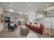 Stylish living room featuring an open floor plan, modern kitchen, and contemporary staircase design at 1372 Lowell Blvd # 4, Denver, CO 80204