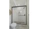 Modern glass walk-in shower featuring white subway tile and matte black hardware in a remodeled bathroom at 1372 Lowell Blvd # 4, Denver, CO 80204