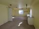 A sunny basement with natural light and a utility countertop and cabinets at 3212 S Kirk Way, Aurora, CO 80013