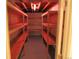 Unfinished basement with utility shelving at 3212 S Kirk Way, Aurora, CO 80013