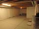 Unfinished basement with exposed ceiling and concrete flooring, ready to customize at 3212 S Kirk Way, Aurora, CO 80013