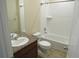 Bathroom featuring a combination tub/shower, vanity with a single sink, and ceramic tile flooring at 3212 S Kirk Way, Aurora, CO 80013