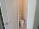 Toilet room with a standard white toilet, neutral walls, and a ceramic tile floor at 3212 S Kirk Way, Aurora, CO 80013