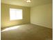 Sunny bedroom with neutral walls and carpet at 3212 S Kirk Way, Aurora, CO 80013