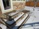 Exterior stone steps of the house, showing an outdoor pathway dusted with snow at 3212 S Kirk Way, Aurora, CO 80013