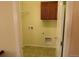 Laundry room equipped with washer and dryer hookups and a storage cabinet at 3212 S Kirk Way, Aurora, CO 80013