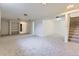 Spacious finished basement with carpet and stairs to the upper level at 16293 E Brown Pl, Aurora, CO 80013