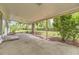Covered patio overlooking backyard with mature trees and partial fencing at 16293 E Brown Pl, Aurora, CO 80013