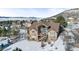 Aerial view of house with backyard and mountain views in winter at 1535 Plowman Dr, Monument, CO 80132