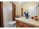 Clean bathroom with shower/tub combo, vanity, and decorative curtain at 1535 Plowman Dr, Monument, CO 80132