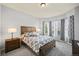 Bright bedroom with bay window, wood bed frame, and neutral decor at 1535 Plowman Dr, Monument, CO 80132