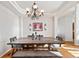 Bright dining room with hardwood floors and a large farmhouse table at 1535 Plowman Dr, Monument, CO 80132