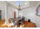 Elegant dining room featuring a wood table and chandelier at 1535 Plowman Dr, Monument, CO 80132