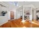 Bright and airy entryway with hardwood floors and wood door at 1535 Plowman Dr, Monument, CO 80132