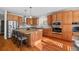 Kitchen with island, stainless steel appliances, and wood cabinets at 1535 Plowman Dr, Monument, CO 80132