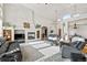 Living room with fireplace and large windows at 1535 Plowman Dr, Monument, CO 80132