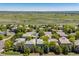 Aerial view of the neighborhood with houses and greenery in the distance at 11969 E Lake Cir, Greenwood Village, CO 80111