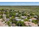 Aerial view of the neighborhood showing houses with mature trees at 11969 E Lake Cir, Greenwood Village, CO 80111