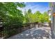 Back deck surrounded by mature trees offering shade and privacy at 11969 E Lake Cir, Greenwood Village, CO 80111