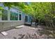 The gravel backyard offers access to the deck and has mature trees at 11969 E Lake Cir, Greenwood Village, CO 80111