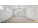 Spacious bedroom with vaulted ceiling, fan, and large window at 11969 E Lake Cir, Greenwood Village, CO 80111